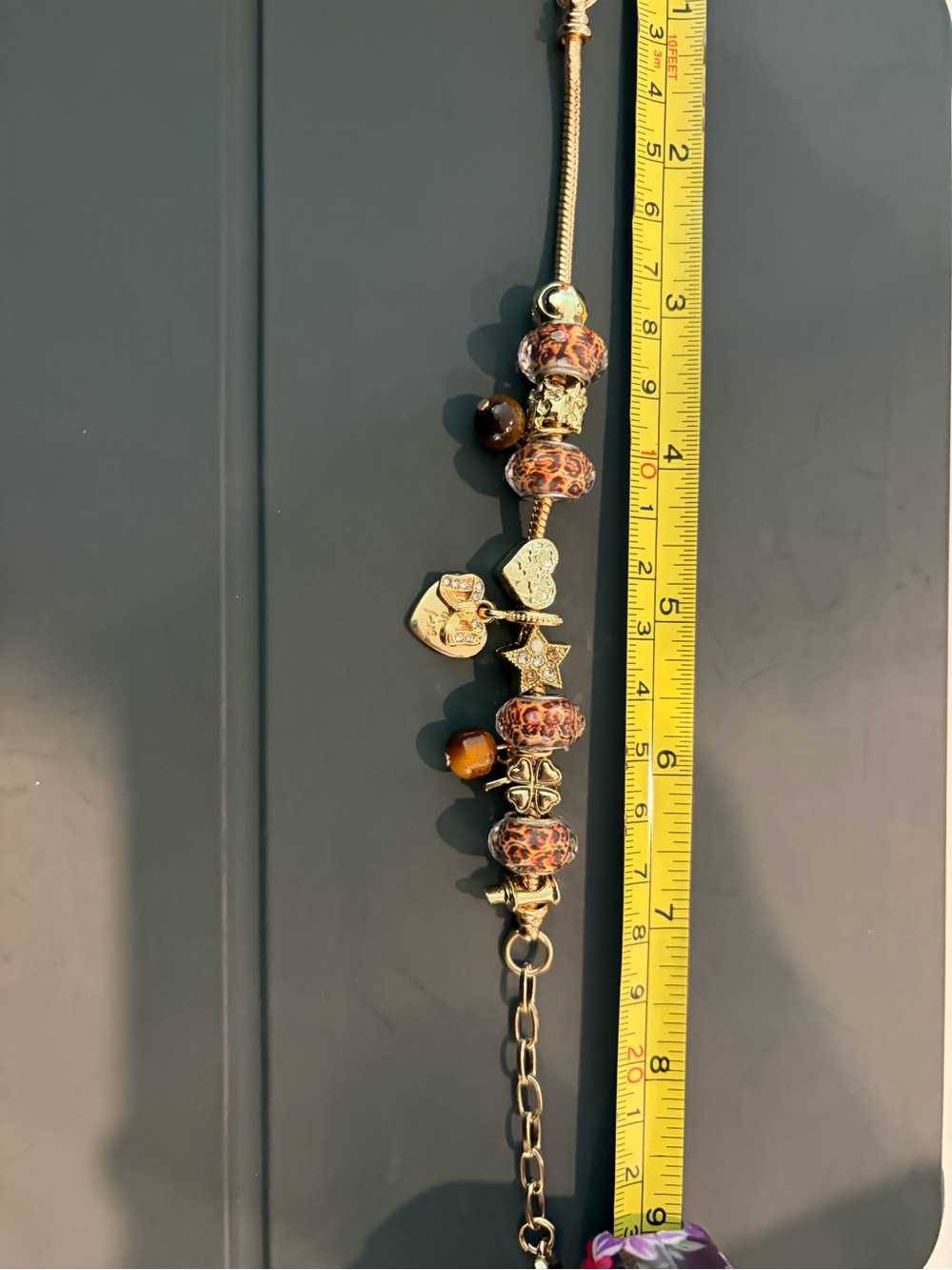 Adjustable cheetah-themed charm bracelet
